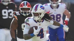 Buffalo Bills running back James Cook III runs the ball for a touchdown against the Cleveland Browns during the first half of an NFL game in Cleveland, Sunday, Dec. 21, 2025. (AP/Sue Ogrocki)