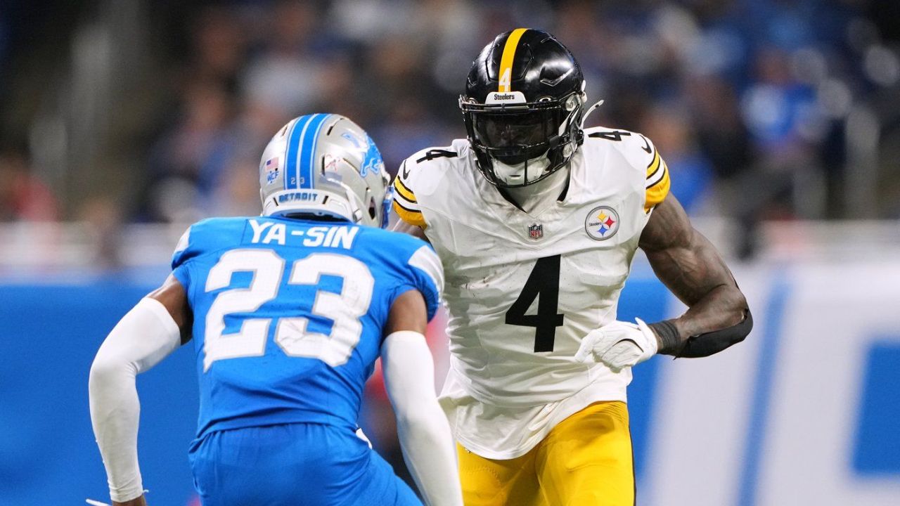 Steelers receiver DK Metcalf swipes at Lions fan leaning over Steelers receiver DK Metcalf swipes at Lions fan leaning over