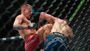 Grant Dawson, left, knees Joe Solecki during the third round of a lightweight bout at the UFC 302 mixed martial arts event Saturday, June 1, 2024, in Newark, N.J. Dawson won the fight. (Frank Franklin II/AP)