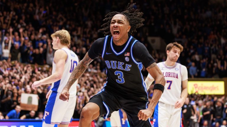Duke's Isaiah Evans (3) celebrates ahead of Florida's Thomas Haugh (10) and Urban Klavzar (7) as time expires in Duke's victory over Florida in an NCAA college basketball game in Durham, N.C., Tuesday, Dec. 2, 2025. (AP Photo/Ben McKeown)
