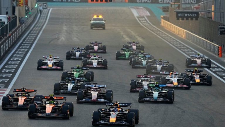 Red Bull driver Max Verstappen of the Netherlands steers his car followed by McLaren driver Lando Norris of Britain during the Formula One Abu Dhabi Grand Prix at the Yas Marina Circuit in Abu Dhabi, UAE, Sunday, Dec. 7, 2025. (AP/Fatima Shbair)