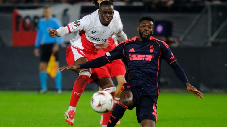 Utrecht's Yoann Cathline, left, duels for the ball with Nottingham Forest's Ibrahim Sangare during the Europa League opening phase soccer match between Utrecht and Nottingham Forest, in Utrecht, Netherlands, Thursday, Dec. 11, 2025. (AP/Patrick Post)