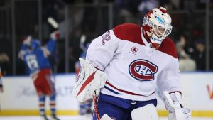 Montréal Canadiens goaltender Jacob Fowler (32) skates off the ice while the New York Rangers celebrate an overtime goal by J.T. Miller during an NHL hockey game, Saturday, Dec. 13, 2025, in New York. (Heather Khalifa/AP)