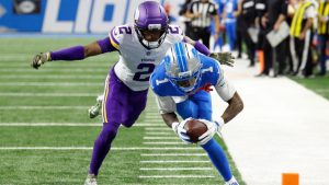 Detroit Lions wide receiver Jameson Williams dives for a touchdown as Minnesota Vikings cornerback Isaiah Rodgers tries to tackle him during an NFL game in Detroit, Sunday, Nov. 2, 2025. (AP/Rick Osentoski)