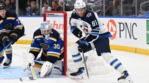 St. Louis Blues goaltender Joel Hofer (30), left, defends the net against Winnipeg Jets left wing Kyle Connor (81) during the third period of an NHL hockey game on Wednesday, Dec. 17, 2025, in St. Louis. (Joe Puetz/AP)