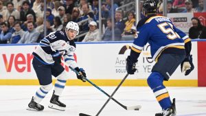 St. Louis Blues defenceman Colton Parayko (55), right, defends against Winnipeg Jets centre Cole Perfetti (91) during the first period of an NHL hockey game on Wednesday, Dec. 17, 2025, in St. Louis. (Joe Puetz/AP)