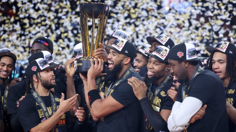 New York Knicks center Karl-Anthony Towns, center, celebrates with teammates after his team's victory against the San Antonio Spurs in the NBA Cup championship basketball game Tuesday, Dec. 16, 2025, in Las Vegas. (AP Photo/Ian Maule)
