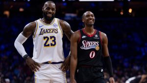 Los Angeles Lakers' LeBron James, left, talks with Philadelphia 76ers' Tyrese Maxey, right, during the first half of an NBA basketball game, Sunday, Dec. 7, 2025, in Philadelphia. (Chris Szagola/AP)