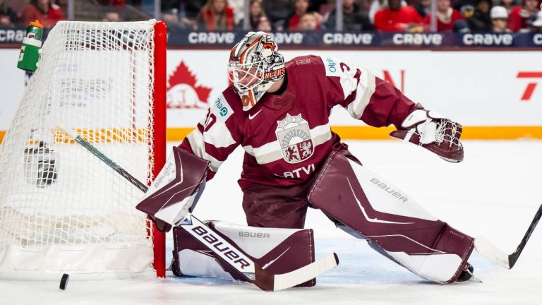 Latvia goaltender Nils Maurins (30) makes a save during first period IIHF World Junior Championship hockey action against Canada, in Minneapolis, Minn., on Saturday, Dec. 27, 2025. (Christopher Katsarov/CP)