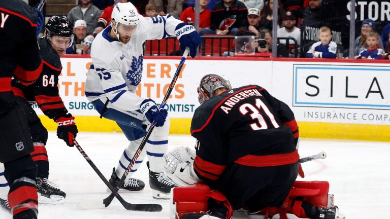 Carolina Hurricanes goaltender Frederik Andersen (31) freezes the shot of Toronto Maple Leafs' Nicolas Roy (55) during the first period of an NHL hockey game in Raleigh, N.C., Thursday, Dec. 4, 2025. (Karl DeBlaker/AP)