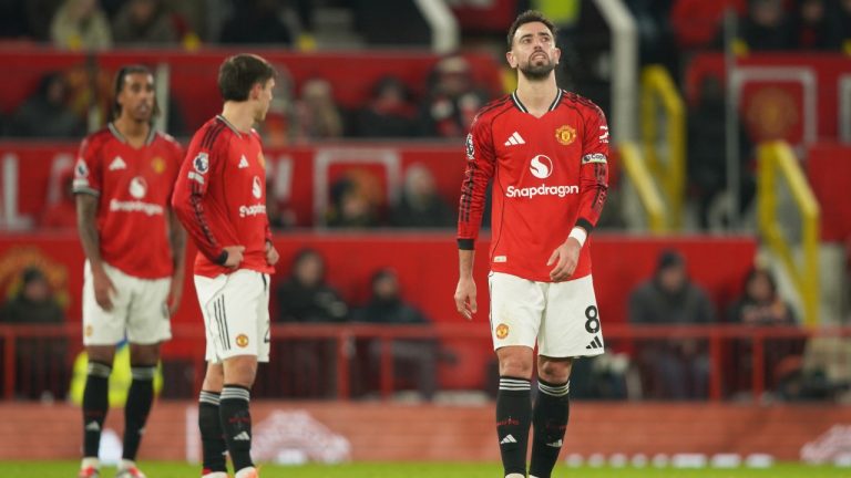 Manchester United's Bruno Fernandes, right, reacts after West Ham's Soungoutou Magassa scored his side's first goal during the English Premier League match between Manchester United and West Ham United in Manchester, England, Thursday, Dec. 4, 2025. (AP/Ian Hodgson)