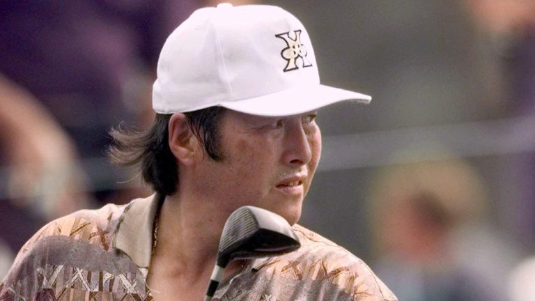 Masashi 'Jumbo' Ozaki, from Japan, watches from the 14th hole at the Augusta National Golf Club in Augusta, Ga., Thursday, April 8, 1999, during first round play of the 1999 Masters. (David J. Phillip/AP)
