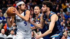 Dallas Mavericks guard Ryan Nembhard (9) looks to pass against Oklahoma City Thunder center/forward Chet Holmgren (7) during the first half of an NBA basketball game, Friday, Dec. 5, 2025, in Oklahoma City. (Gerald Leong/AP)