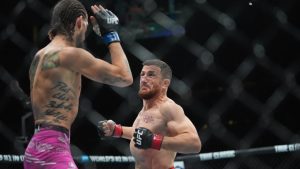 Georgia's Merab Dvalishvili, right, fights Sean O'Malley during the first round of a bantamweight title bout at the UFC 316 mixed martial arts event Sunday, June 8, 2025 in Newark, N.J. (Frank Franklin II/AP)
