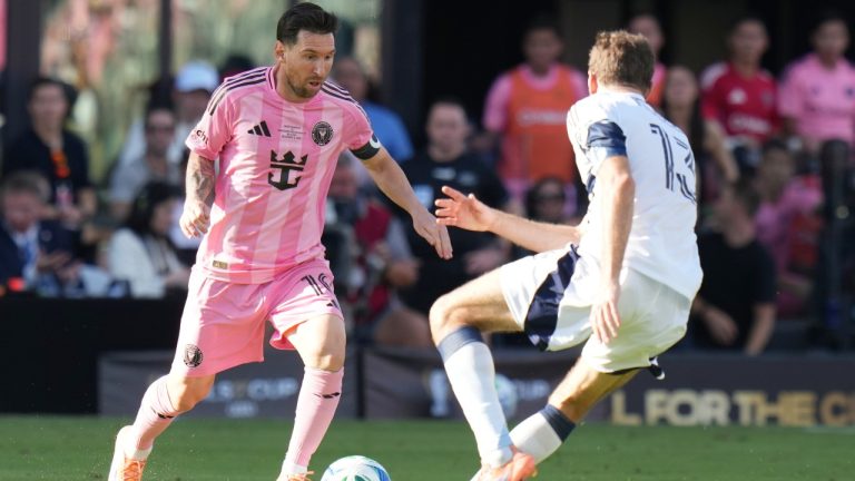 Inter Miami forward Lionel Messi (10) runs with the ball as Vancouver Whitecaps forward Thomas Müller (13) defends during the first half of the MLS Cup final soccer match Saturday, Dec. 6, 2025, in Fort Lauderdale, Fla. (Lynne Sladky/AP)