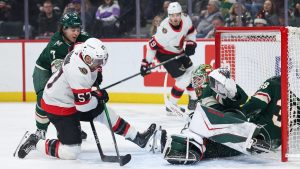 Minnesota Wild goaltender Jesper Wallstedt (30) defends his net as Ottawa Senators left wing David Perron (57) attempts a shot during the first period of an NHL hockey game Saturday, Dec. 13, 2025, in St. Paul, Minn. (Matt Krohn/AP)