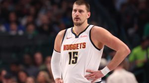 Denver Nuggets center Nikola Jokic looks on during the first half of an NBA basketball game against the Dallas Mavericks Tuesday, Dec. 23, 2025, in Dallas. (AP Photo/Sam Hodde)