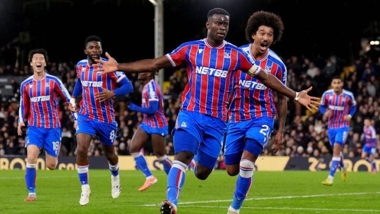 Crystal Palace's Marc Guehi celebrates after scoring his sides second goal during the English Premier League match between Fulham and Crystal Palace, in London, Sunday, Dec. 7, 2025. (John Walton/PA via AP)