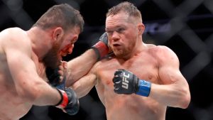 Petr Yan, right, battles Merab Dvalishvili at UFC 323 in Las Vegas. (Steve Marcus/Las Vegas Sun via AP)