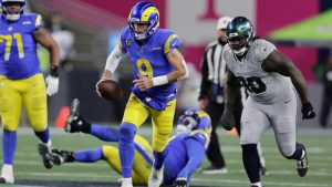 Los Angeles Rams quarterback Matthew Stafford scrambles during the first half of an NFL football game against the Seattle Seahawks, Thursday, Dec. 18, 2025, in Seattle. (John Froschauer/AP)