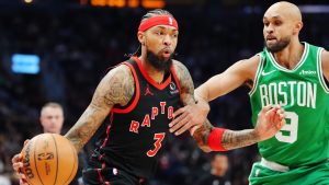 Toronto Raptors' Brandon Ingram (3) protects the ball from Boston Celtics' Derrick White (9) during first half NBA basketball action in Toronto on Saturday, Dec. 20, 2025. (Frank Gunn/CP)