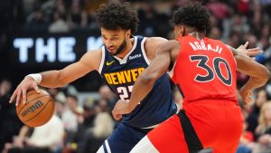 Denver Nuggets guard Jamal Murray (27) tries to get around Toronto Raptors guard Ochai Agbaji (30) during first half NBA action in Toronto on Wednesday December 31, 2025. (Frank Gunn/CP)