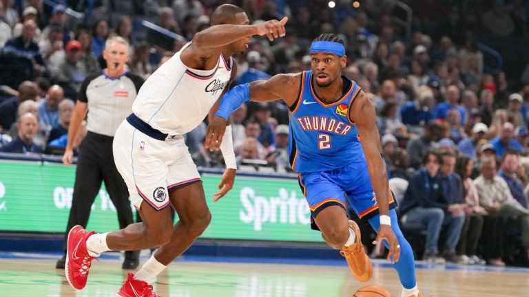 Oklahoma City Thunder guard Shai Gilgeous-Alexander drives past Los Angeles Clippers guard Kris Dunn, left, during the first half of an NBA game, Thursday, Dec. 18, 2025, in Oklahoma City. (AP/Kyle Phillips)
