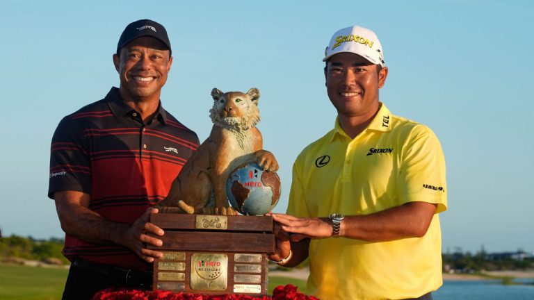Hideki Matsuyama, of Japan, right, poses for a photo with golf legend Tiger Woods after winning the Hero World Challenge PGA Tour at the Albany Golf Club, in New Providence, Bahamas, Dec. 7, 2025. (Fernando Llano/ AP)