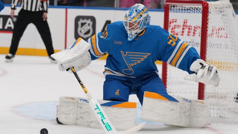 St. Louis Blues goaltender Jordan Binnington deflects a puck during the first period of an NHL hockey game against the Utah Mammoth Thursday, Oct. 23, 2025, in St. Louis. (Jeff Roberson/AP)