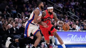 Toronto Raptors forward Brandon Ingram (3) drives past New York Knicks guard Mikal Bridges (25) during the first half of an NBA basketball game Sunday, Nov. 30, 2025, in New York. (Yuki Iwamura/AP)