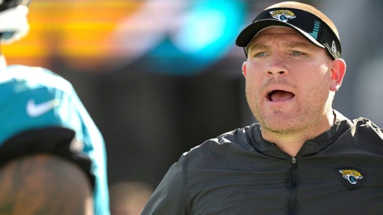 FILE -Jacksonville Jaguars defensive line coach Tosh Lupoi, right, calls out instructions on the sideline during the second half of an NFL game against the Indianapolis Colts, Jan. 9, 2022, in Jacksonville, Fla. (AP/Phelan M. Ebenhack, File)