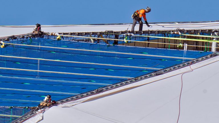 Workers continue to repair the panels on the roof of Tropicana Field Monday, Nov. 3, 2025, in St. Petersburg, Fla. The roof was destroyed by Hurricane Milton in 2024. (Chris O'Meara/AP)