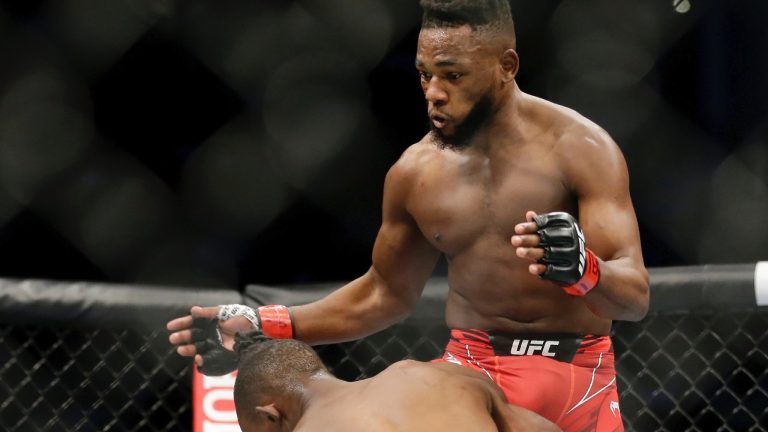 Marvel Kape throws a flying knee during a UFC flyweight mixed martial arts bout. (Michael Wyke/AP)