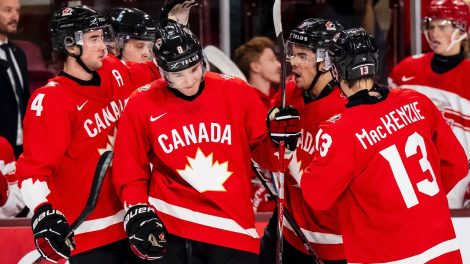 Canada's-Braeden-Cootes-(8)-celebrates-with-teammates-after-scoring-during-first-period-IIHF-World-Junior-Championship-hockey-action-against-Denmark-in-Minneapolis-on-Monday,-Dec.-29,-2025.-THE-CANADIAN-PRESS/Christopher-Katsarov