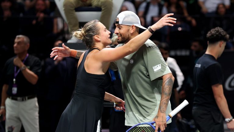 Nick Kyrgios and Aryna Sabalenka embrace at the net at the end of their Battle of the Sexes match, in Dubai, United Arab Emirates, Sunday Dec. 28, 2025. (Christopher Pike/AP)