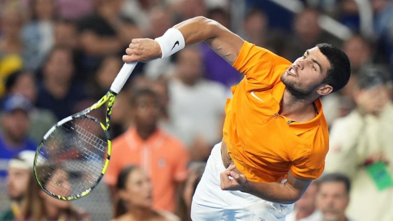Carlos Alcaraz follows through on a serve to Joao Fonseca during the Miami Tennis Invitational tournament, Monday, Dec. 8, 2025, in Miami. (Lynne Sladky/AP)