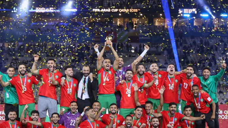 Morocco's players celebrate with the winner trophy after defeating Jordan in the FIFA Arab Cup final soccer match in Lusail, Qatar, Thursday, Dec. 18, 2025. (Hussein Sayed/AP)