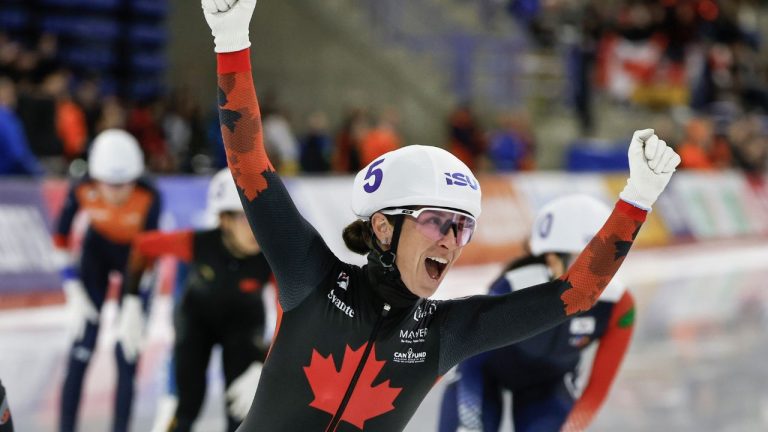 Canada's Ivanie Blondin, centre, celebrates winning the women's mass start competition at the ISU World Cup speed skating event in Calgary, Alta., Sunday, Nov. 23, 2025. (Jeff McIntosh/CP)