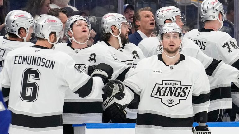 Los Angeles Kings right wing Adrian Kempe celebrates with the bench, including defenceman Joel Edmundson (6) after scoring against the Tampa Bay Lightning during the second period of an NHL hockey game Thursday, Dec. 18, 2025, in Tampa, Fla. (Chris O'Meara/AP)