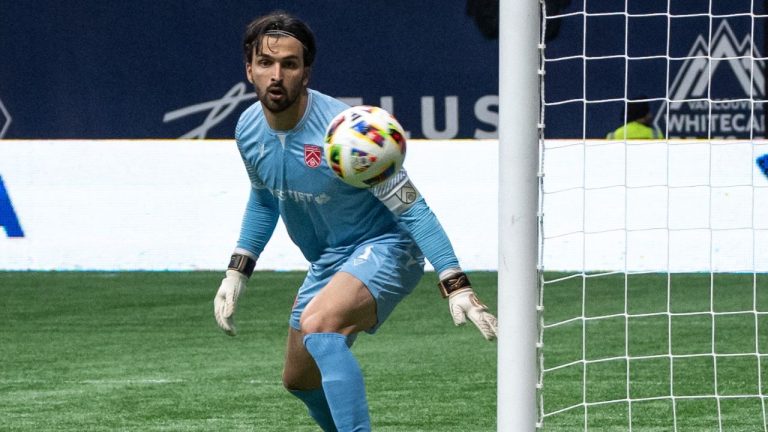 Cavalry FC goalkeeper Marco Carducci watches the ball go wide of the net against the Vancouver Whitecaps during the second half of a Canadian Championship quarterfinal soccer match, in Vancouver, on Tuesday, May 21, 2024. (Ethan Cairns/CP)