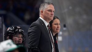 Canada head coach Troy Ryan watches play during the second period of a Rivalry Series women's hockey game against the United States, Saturday, Nov. 8, 2025, in Buffalo, N.Y. (Adrian Kraus/AP)