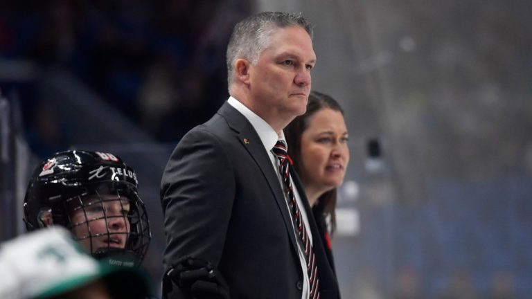 Canada head coach Troy Ryan watches play during the second period of a Rivalry Series women's hockey game against the United States, Saturday, Nov. 8, 2025, in Buffalo, N.Y. (Adrian Kraus/AP)