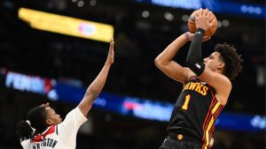 Atlanta Hawks forward Jalen Johnson (1) shoots against Washington Wizards guard Bub Carrington (7) during the second half of an NBA basketball game, Saturday, Dec. 6, 2025, in Washington. (Nick Wass/AP)