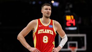 Atlanta Hawks center Kristaps Porzingis (8) reacts during the second half of an NBA basketball game against the Denver Nuggets, Friday, Dec. 5, 2025, in Atlanta. (AP Photo/Colin Hubbard)