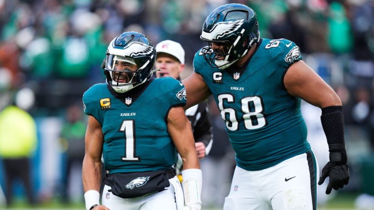 Philadelphia Eagles quarterback Jalen Hurts (1) and Eagles offensive tackle Jordan Mailata (68) celebrate the touchdown of Eagles wide receiver A.J. Brown during the second half of an NFL football game against the Las Vegas Raiders on Sunday, Dec. 14, 2025, in Philadelphia. (AP Photo/Chris Szagola)