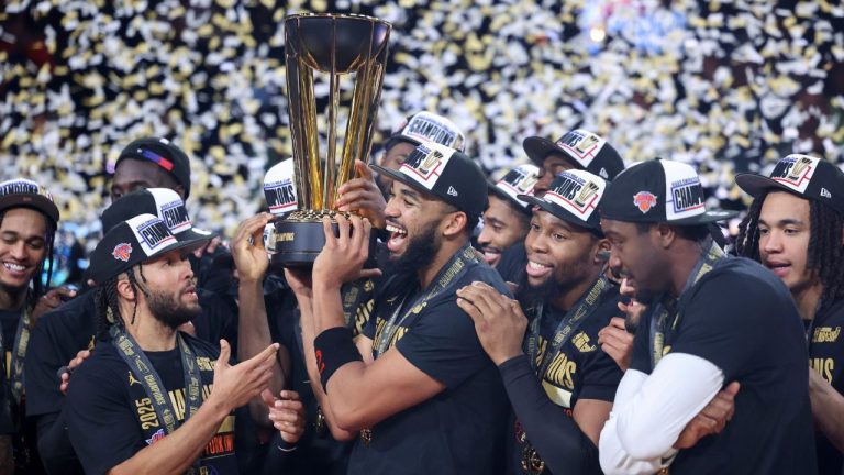 New York Knicks center Karl-Anthony Towns, center, celebrates with teammates after his team's victory against the San Antonio Spurs in the NBA Cup championship basketball game Tuesday, Dec. 16, 2025, in Las Vegas. (AP Photo/Ian Maule)