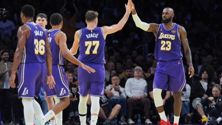 Los Angeles Lakers forward LeBron James (23) high-fives guard Luka Doncic (77) during the second half of an NBA Cup basketball game against the Los Angeles Clippers Tuesday, Nov. 25, 2025, in Los Angeles. (Jae C. Hong/AP)