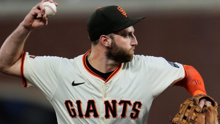 San Francisco Giants third baseman Casey Schmitt throws to first for an out during the second inning of a baseball game, Wednesday, Sept. 24, 2025, in San Francisco. (AP Photo/Godofredo A. Vásquez)