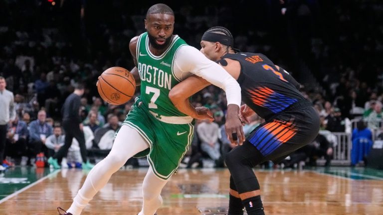 Boston Celtics guard Jaylen Brown (7) drives around New York Knicks guard Josh Hart (3) during the first half of a game, Tuesday, Dec. 2, 2025, in Boston. (AP Photo/Charles Krupa)