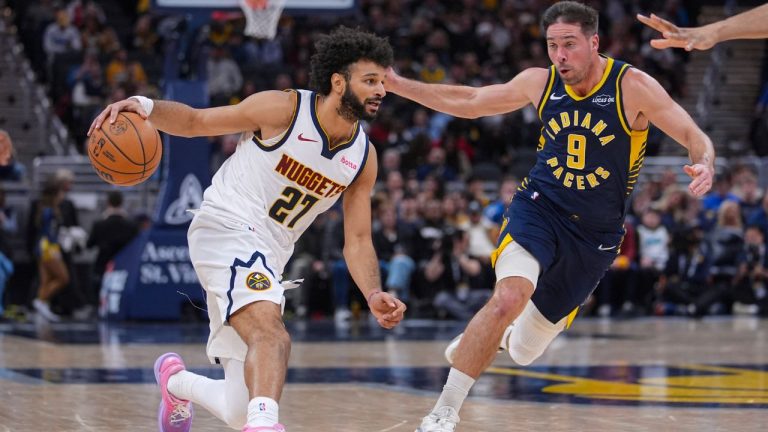 Denver Nuggets guard Jamal Murray (27) drives on Indiana Pacers guard T.J. McConnell (9) during the second half of an NBA basketball game in Indianapolis, Wednesday, Dec. 3, 2025. (Michael Conroy/AP)